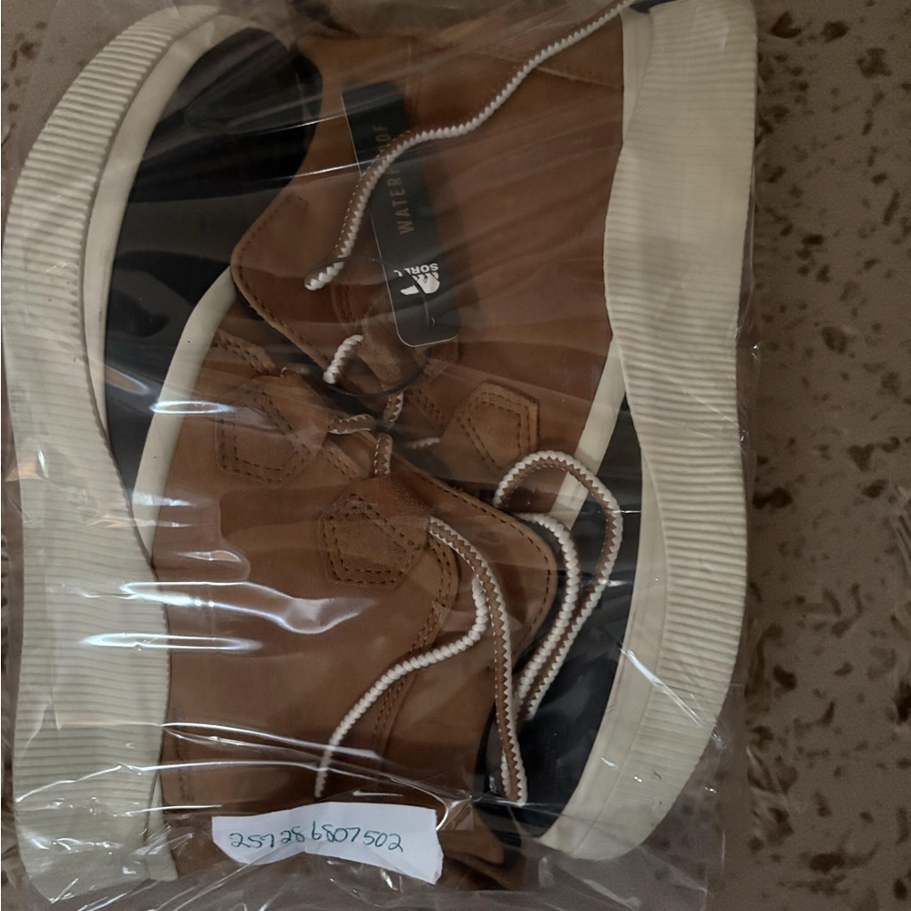 Sorel Tan and Black Winter Boots